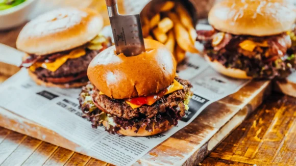 Stacked beef burgers with cheese and fries served at The Hercules Pillars pub on Great Queen Street