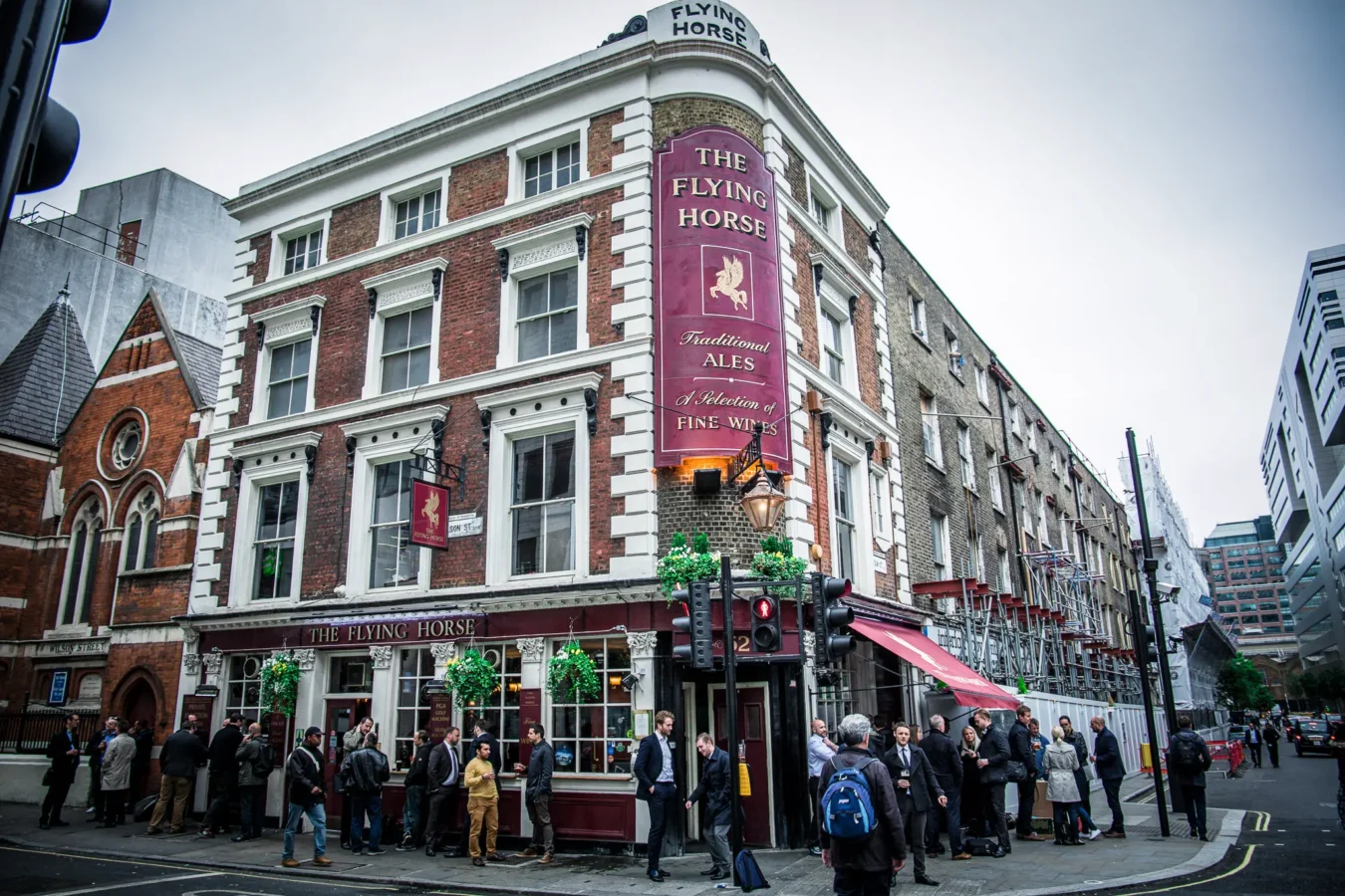 The exterior of The Flying Horse Grade II listed pub on the corner of Wilson Street and Sun Street, EC2A, near Liverpool Street