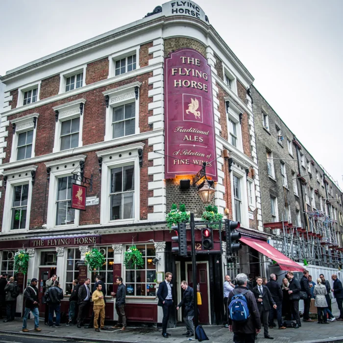 The exterior of The Flying Horse Grade II listed pub on the corner of Wilson Street and Sun Street, EC2A, near Liverpool Street