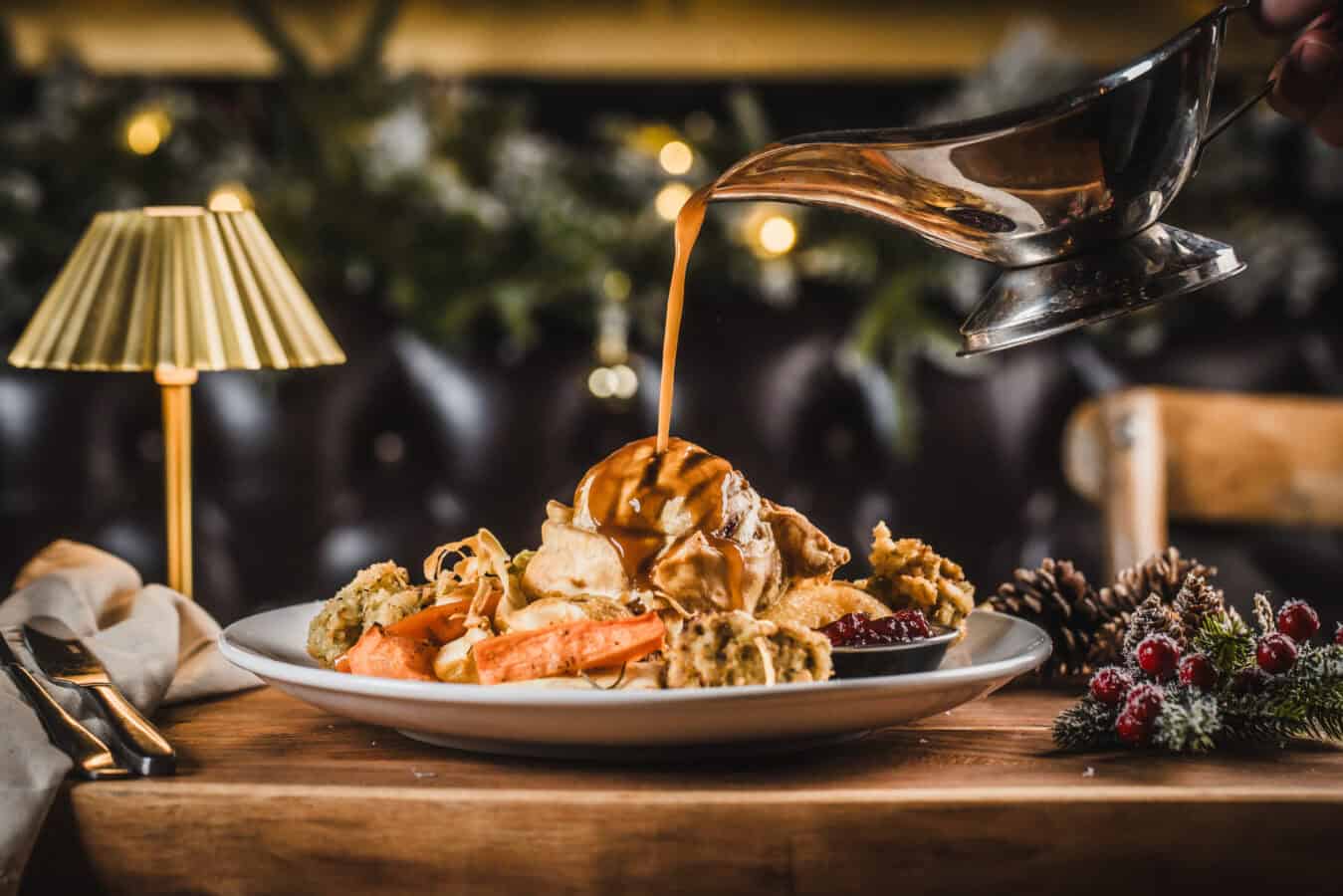 Festive dessert platter with ice cream, caramel sauce, and berries at The Flying Horse.