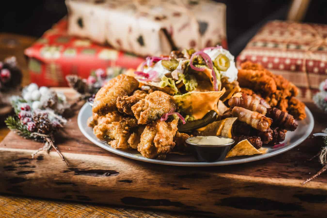 Plate of fried chicken, ribs, and salad at The Flying Horse pub.