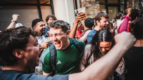 People enjoying drinks and socialising at The Flying Horse pub.